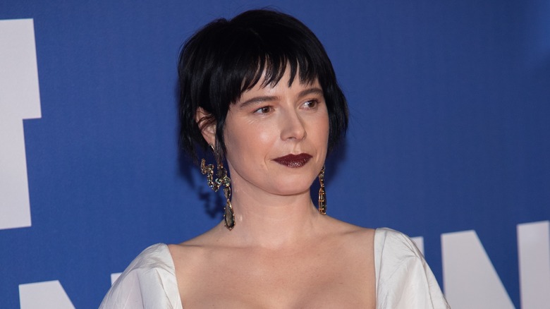 Jessie Buckley posing on step-and-repeat