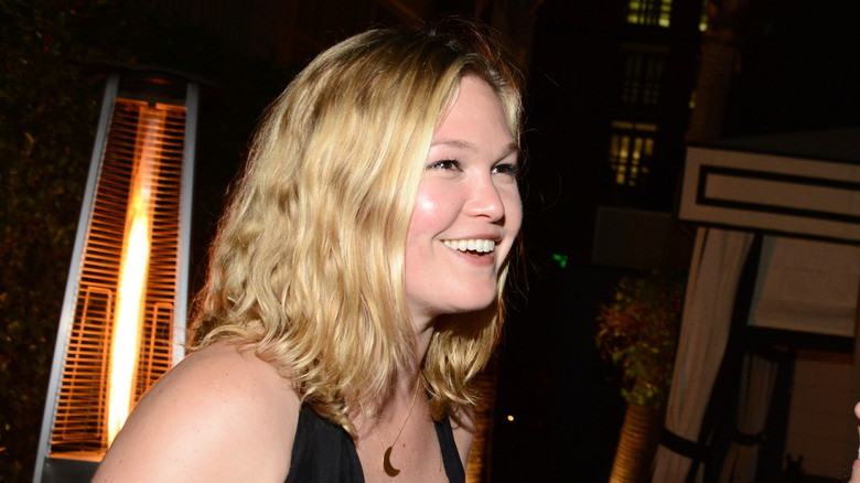 Julia Stiles laughing to side