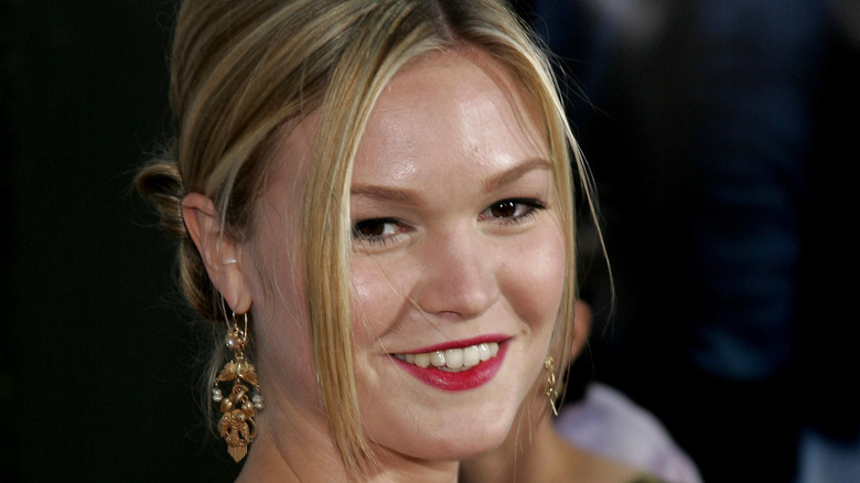 Julia Stiles smiling with her hair up