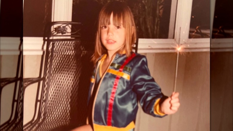 The young Kendra Scott with a sparkler