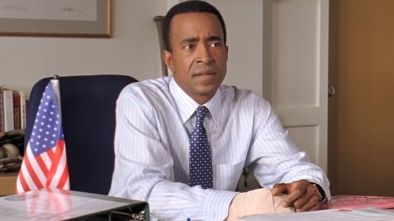 Mean Girls principal sitting at desk