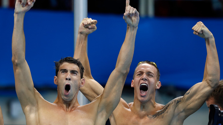 Michael Phelps and Caeleb Dressel cheering