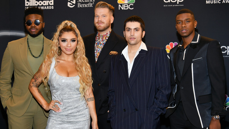 Pentatonix posing on the red carpet