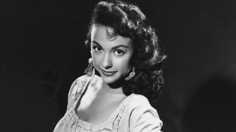 Young Rita Moreno smiling