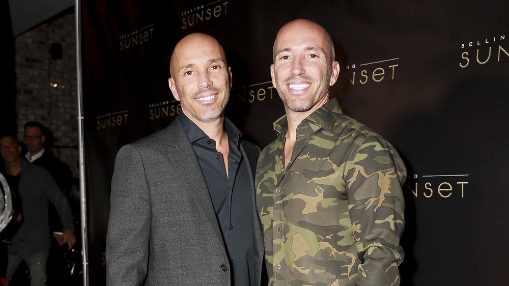 Jason and Brett Oppenheim smiling at an event 