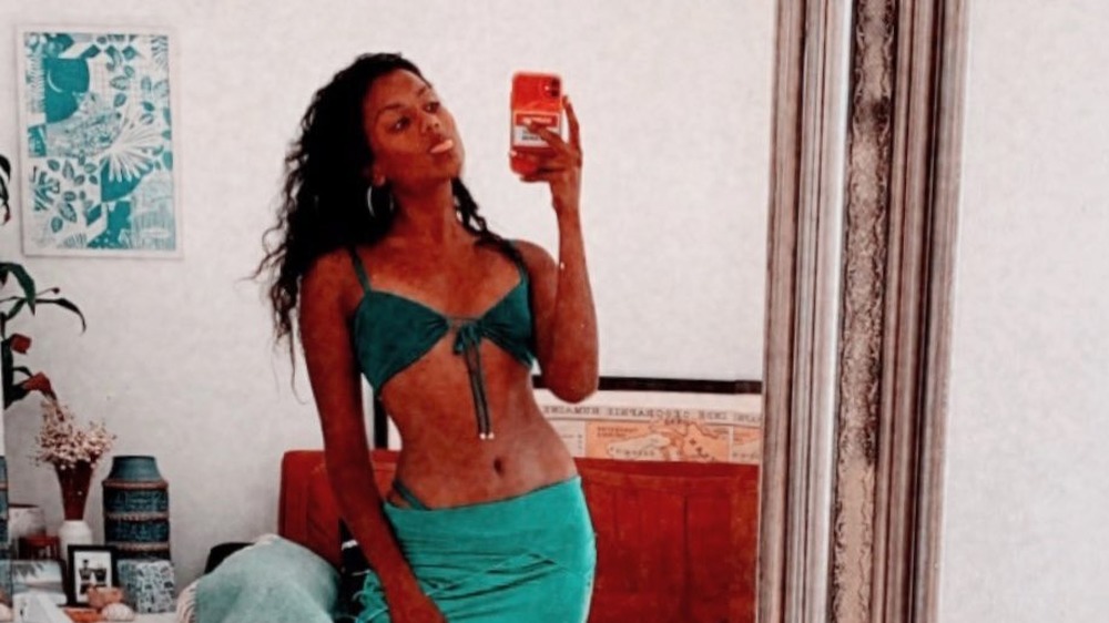 Simone Ashley taking a selfie