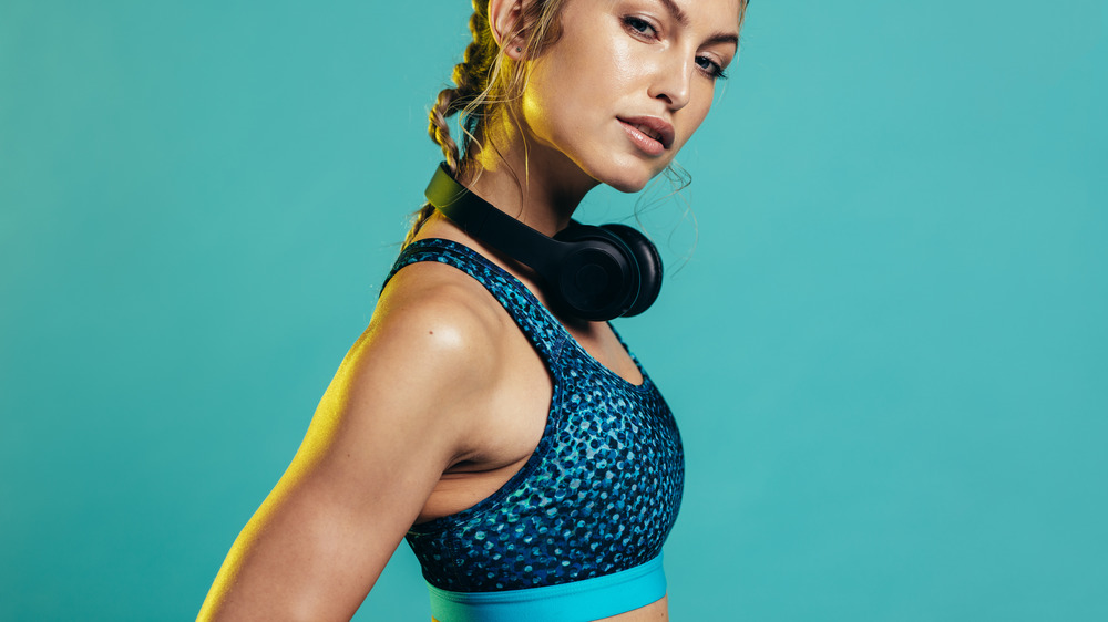 A woman wearing a blue sports bra