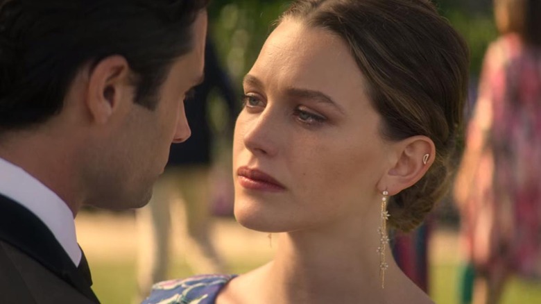 Victoria Pedretti and Penn Badgley in You