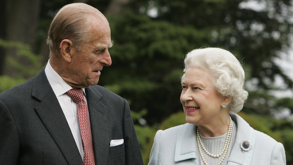 Queen Elizabeth and Prince Philip in a garden