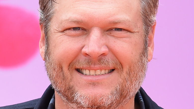 Blake Shelton poses with a smile