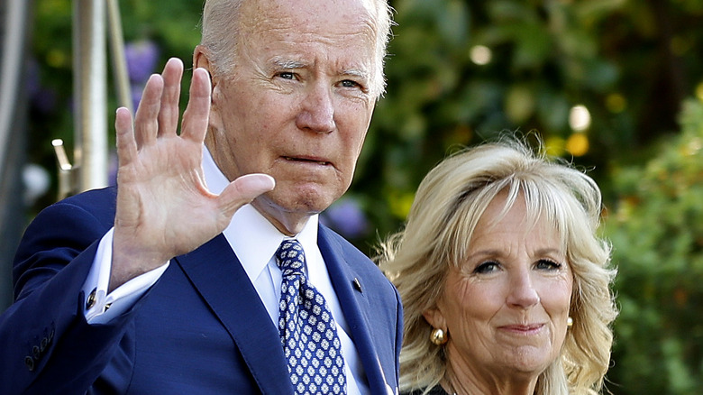 Joe and Jill Biden walking by White House