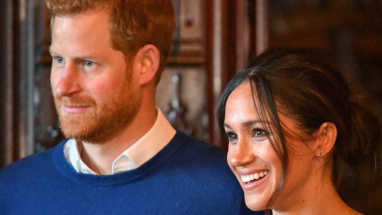 Prince Harry and Meghan Markle smiling