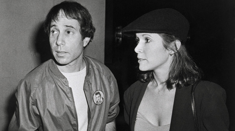 Paul Simon and Carrie Fisher at a reception following a private screening of "Carney"
