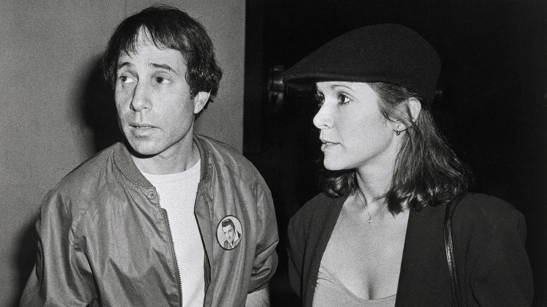 Paul Simon and Carrie Fisher at a reception following a private screening of "Carney"