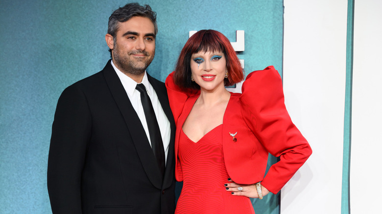 Michael Polansky wearing black and Lady Gaga wearing red