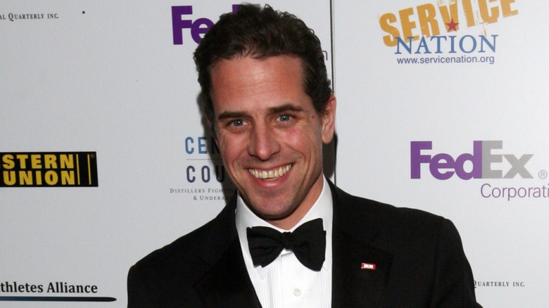 Hunter Biden smiling on step-and-repeat