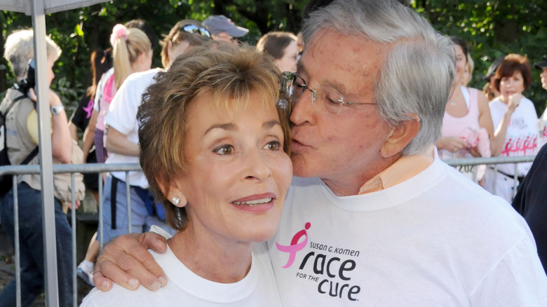 Jerry Sheindlin kissing Judy Sheindlin's cheek smiling at Susan G. Komen Race for the Cure in 2009