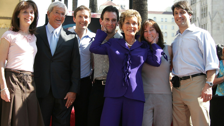 Jamie Hartwright, Adam Bruce Levy, Judy, Jerry, Gregory, Jonathan, and Nicole Sheindlin smiling at Judy's Hollywood Walk of Fame ceremony in 2006