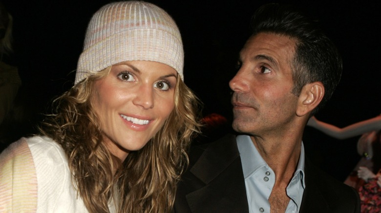 Lori Loughlin wearing a white beanie alongside Mossimo Giannulli