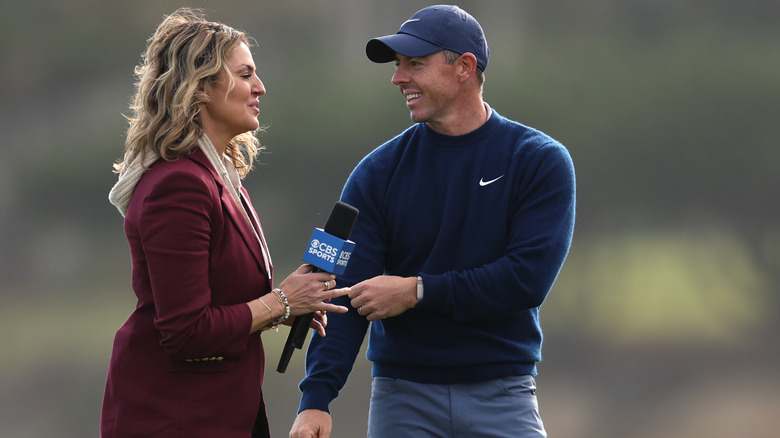 Amanda Balionis standing next to Rory McIlroy