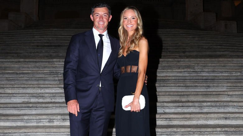 Rory McIlroy with his arm around Erica Stoll