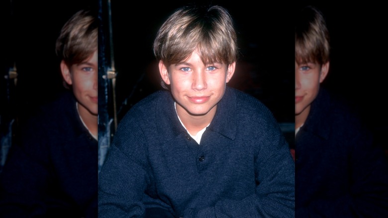 Jonathan Taylor Thomas poses for a photo in 1994