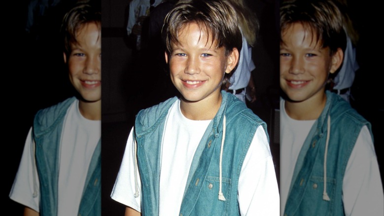 Jonathan Taylor Thomas smiles for a photo circa the '90s