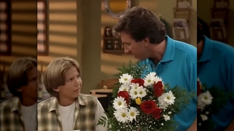 Jonathan Taylor Thomas and Tim Allen in a scene from "Home Improvement"