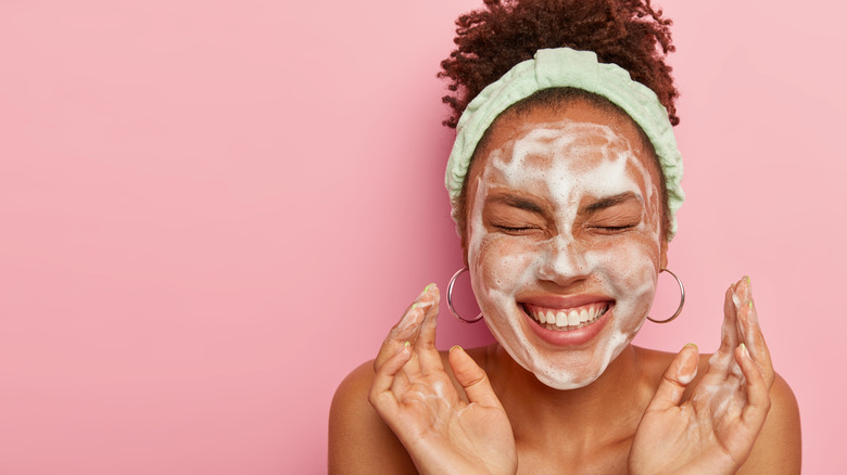Woman with soap on face
