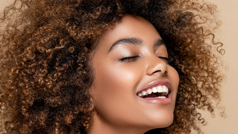 Woman with glossy lids 