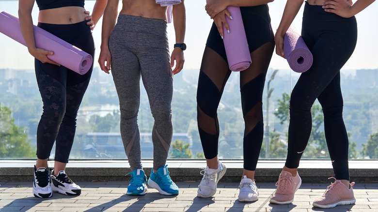 A group of women wearing leggings 