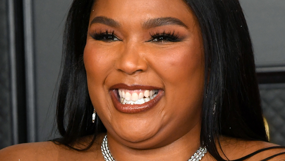 Lizzo smiling at Grammy Awards