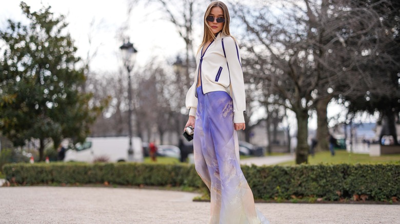 Woman in orange silk skirt