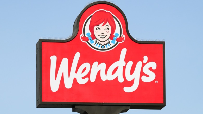 Wendy's restaurant sign in front of clear blue sky