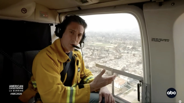 David Muir reporting on the Los Angeles wildfires during a helicopter flyover