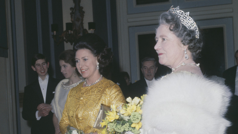 Pincess Margaret and the Queen Mother at a party