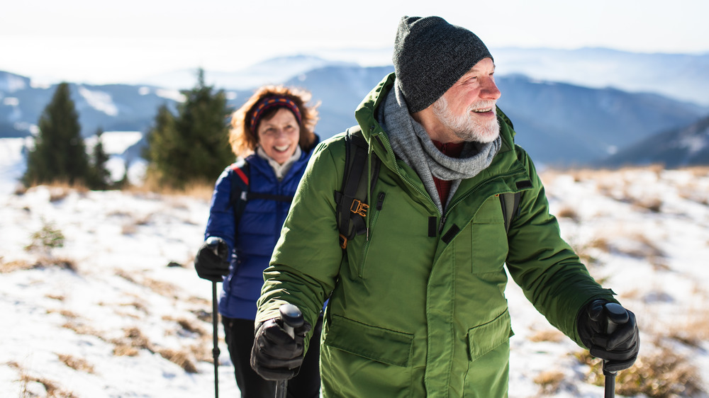 Couple walking mountain in winter