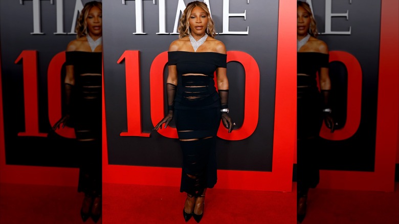 Serena Williams in black dress that looks composed of straps of unconnected fabric