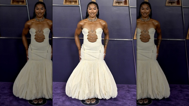 Jordan Chiles smiling in white dress with puffy skirt