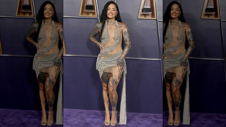 Kehlani posing in a silver dress