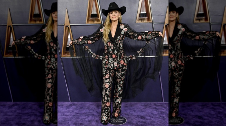 Lainey Wilson posing in embellished outfit