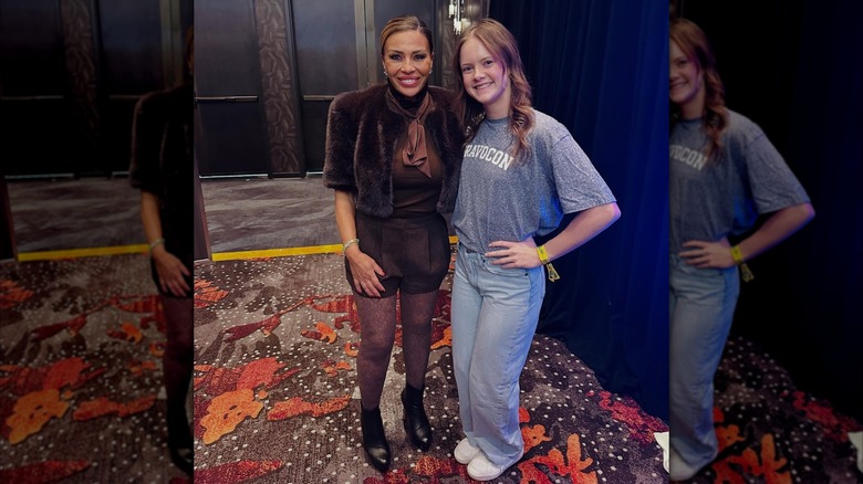 Dolores Catania posing with a fan