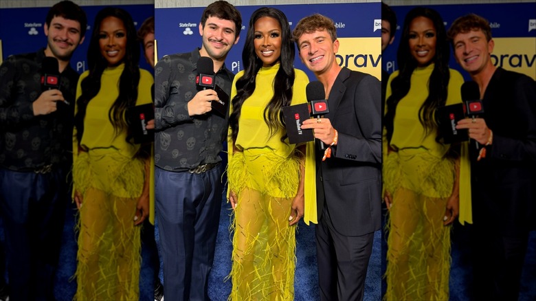 Stacey Rusch posing with interviewers on the red carpet