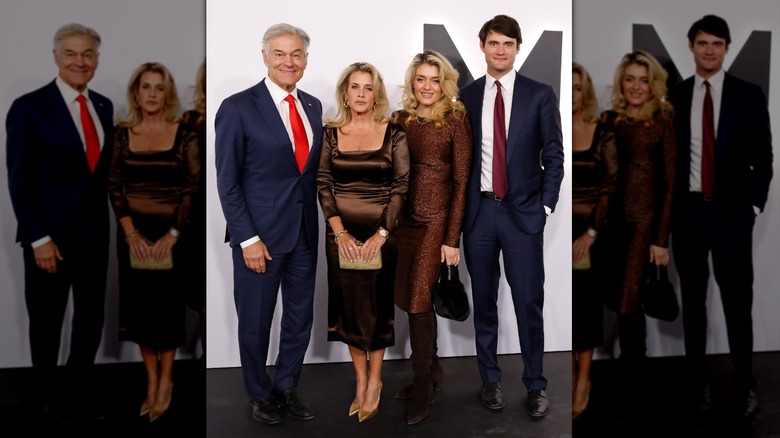 Dr. Oz standing with his wife and kids