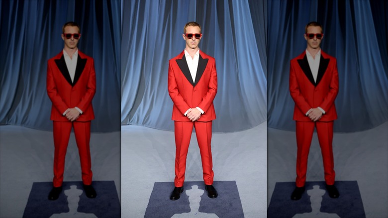 Jeremy Strong in a red tux with sunglasses on