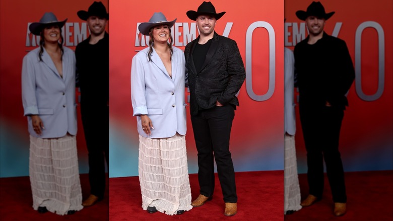 Jaclyn Singletary Gibson and Seth Gibson posing on the red carpet