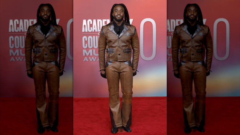 Shaboozey posing in leather suit