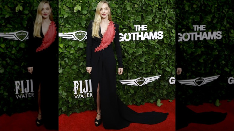 Amanda Seyfried posing in a black gown