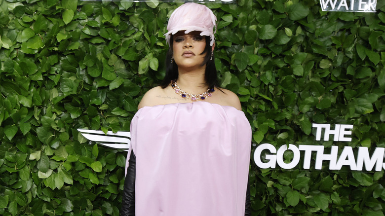 Rihanna posing in a pink outfit