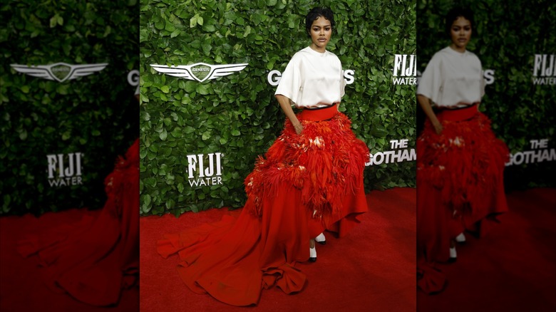 Teyana Taylor posing in a red skirt
